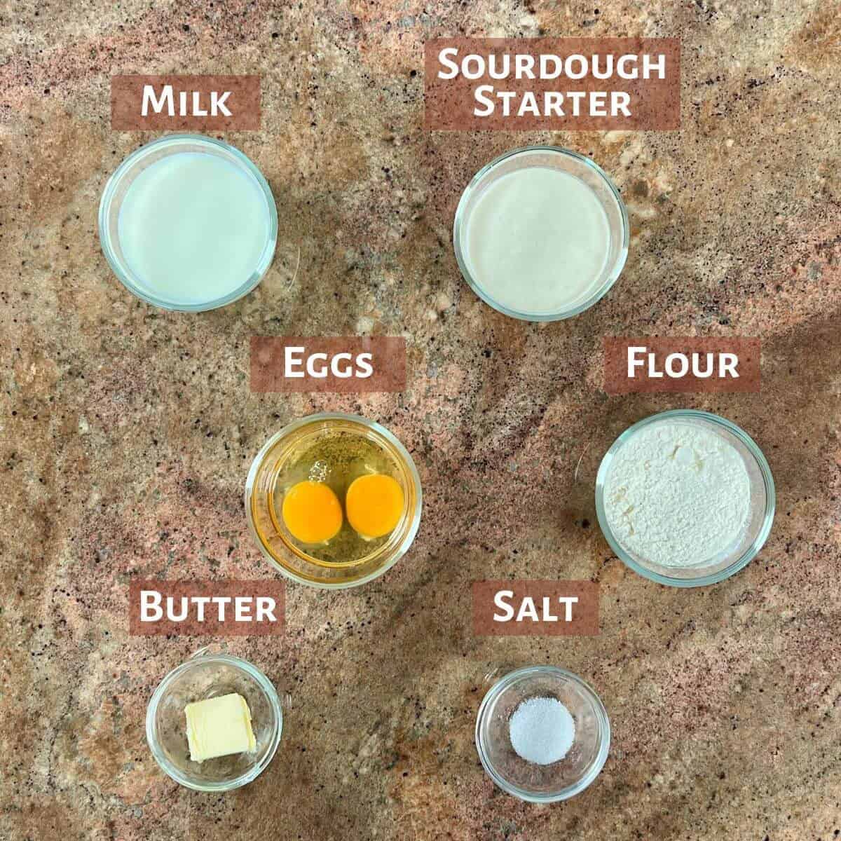 Ingredients for Sourdough Discard Popovers portioned into glass bowls.