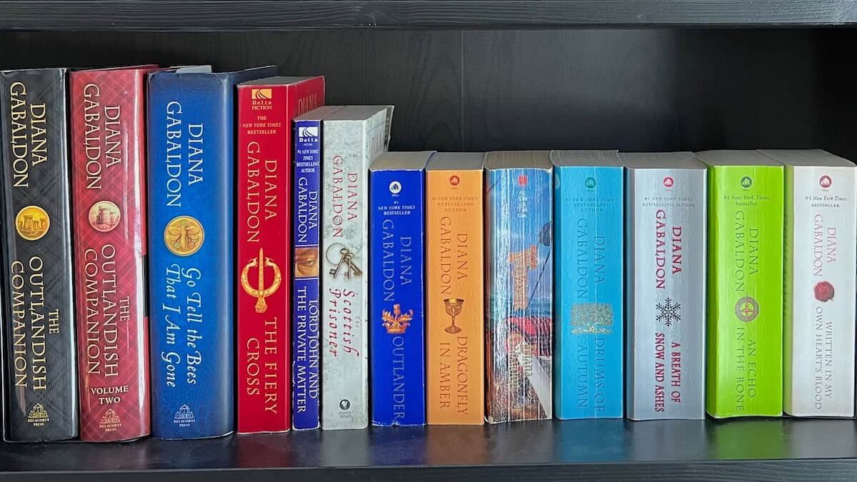 Diana Gabaldon's Outlander books on a bookshelf.