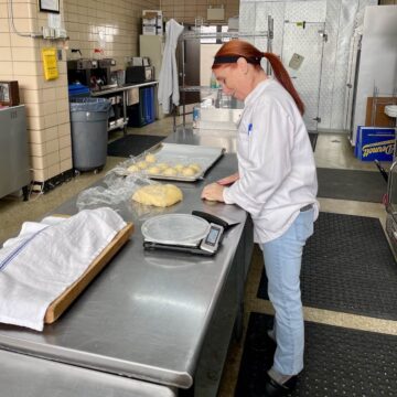Tammy prepping portions of challah dough prior to class.