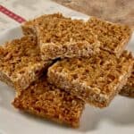 British flapjacks stacked on a white plate.