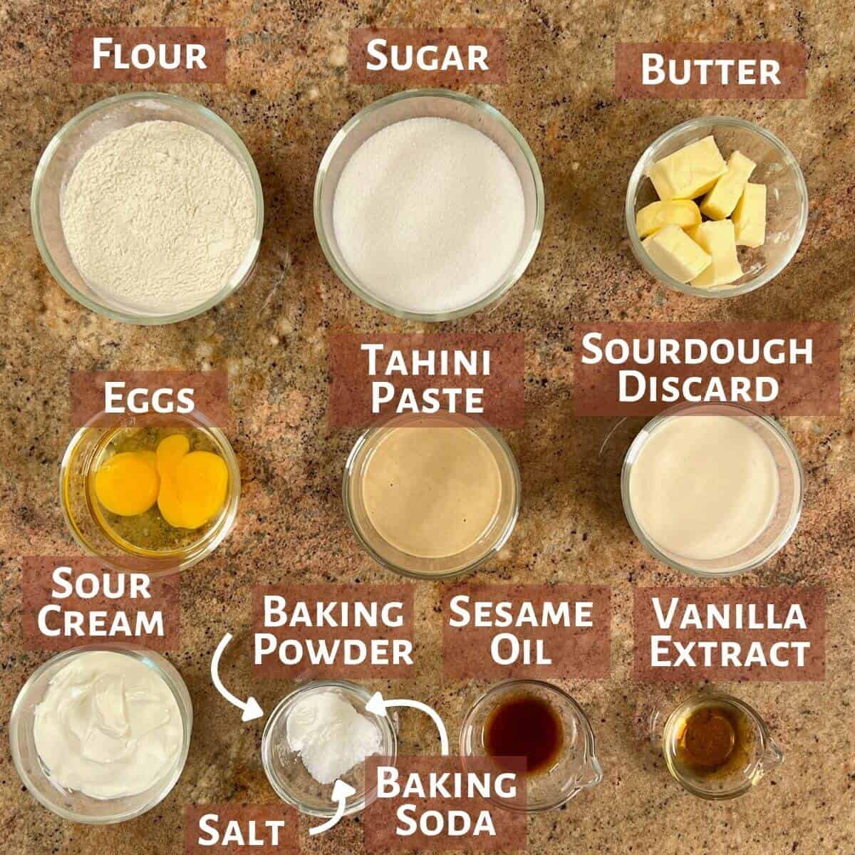 Ingredients for the cake batter portioned into glass bowls.