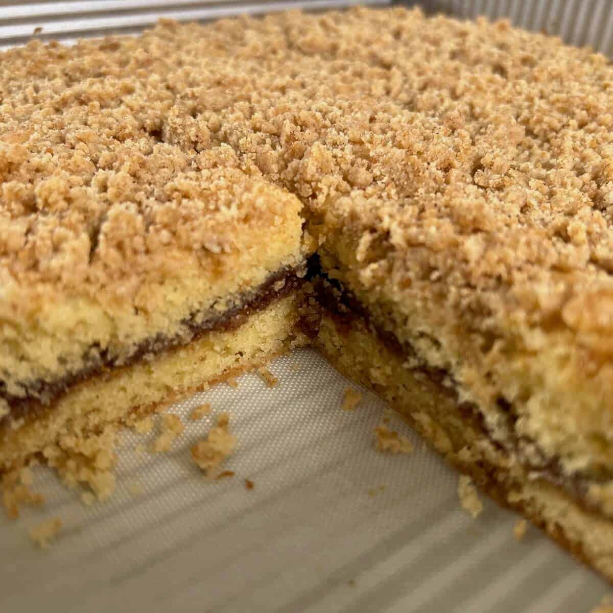 Sourdough Discard Tahini Coffee Cake cut showing interior in the baking pan.