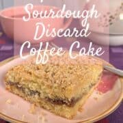 Sourdough Discard Tahini Coffee Cake and a fork on a pink plate with a pink teacup and teapot behind it Pinterest banner.