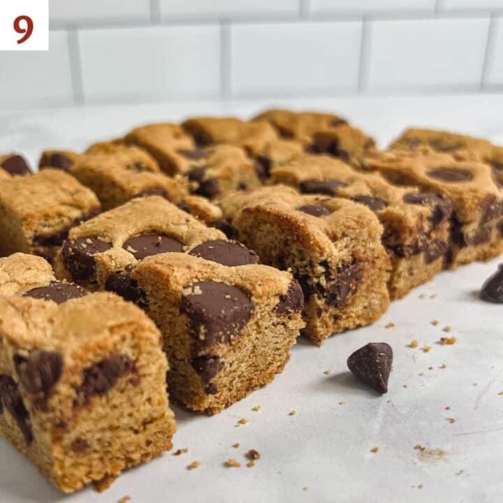 Chocolate Chip Cookie Bars portioned into bars on a counter.