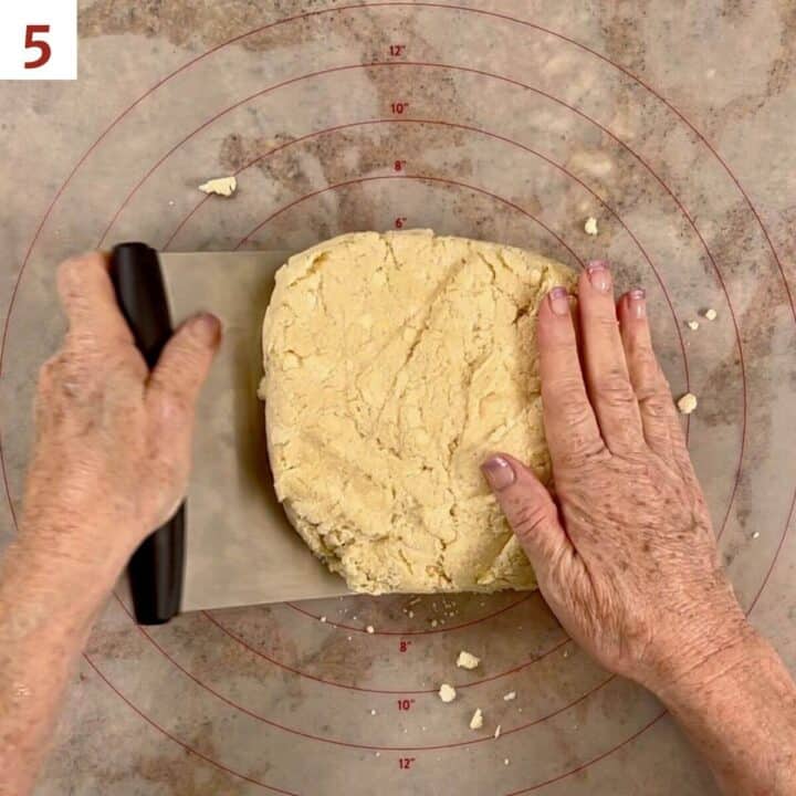 Folding scone down in half with a bench scraper.