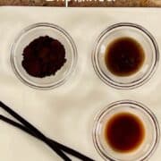 Vanilla bean powder, vanilla bean paste, vanilla extract, and 2 whole vanilla beans on a white plate Pinterest banner.